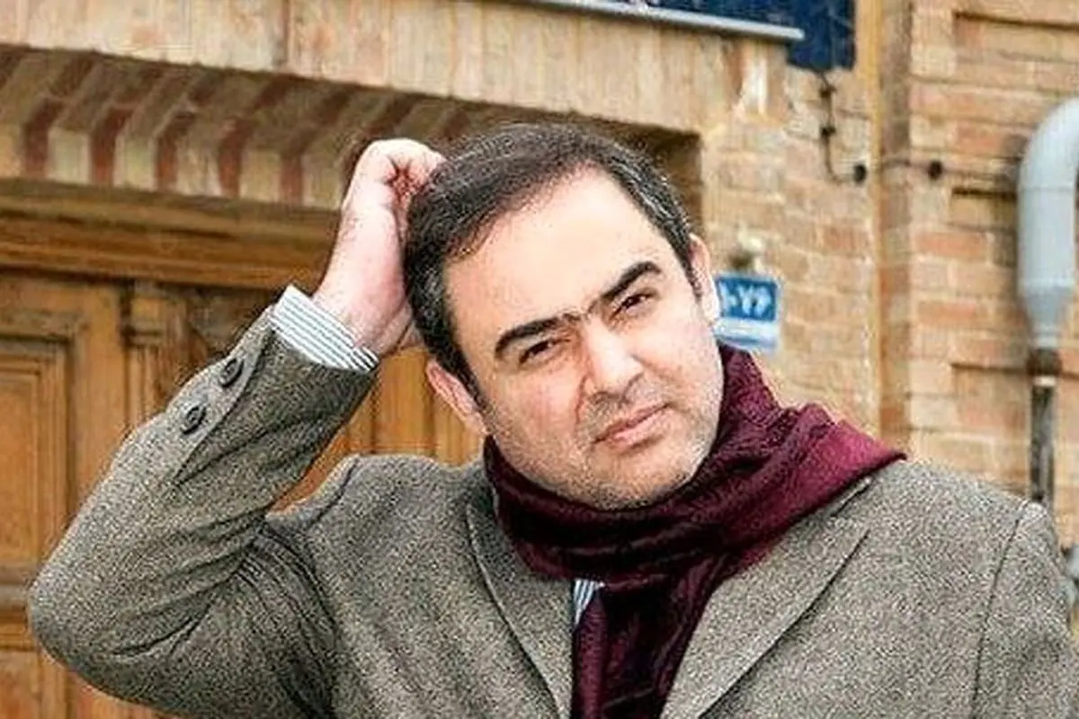 عکس نادر حسین دهباشی و وحید جلیلی در کنار سرباز آمریکایی در سفر به عراق پس از سقوط صدام