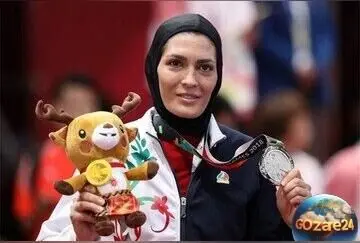 الهه منصوریان در جشن بیستمین سالگرد ووشو؛ امضای خاص و جمله‌ای که نشان‌دهنده عشق او به این رشته است