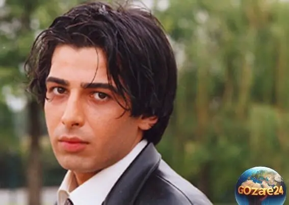 استایل خاص و گنگ حمید گودرزی در قلب اروپا با کت جین، عینک دودی و کوله پشتی